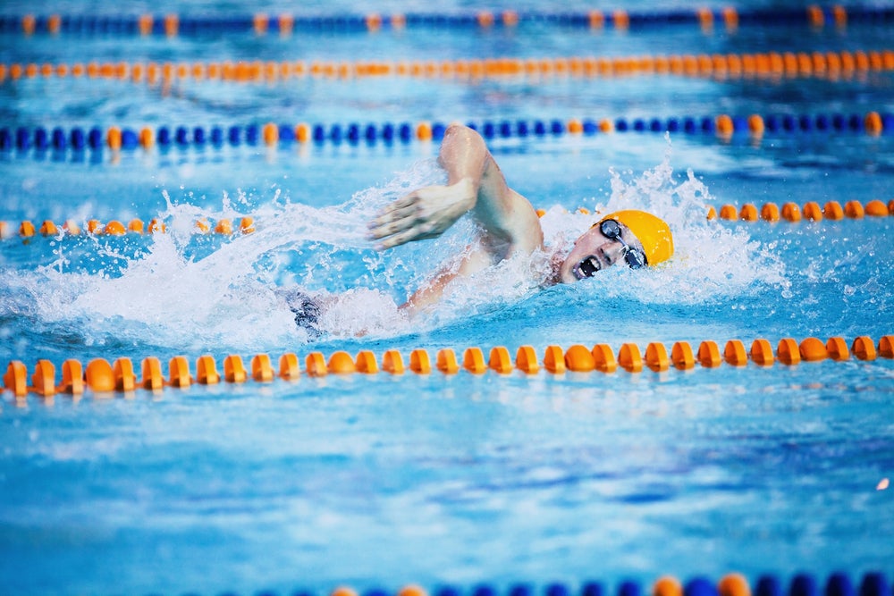An athlete swims freestyle as part of a One-hour Workout