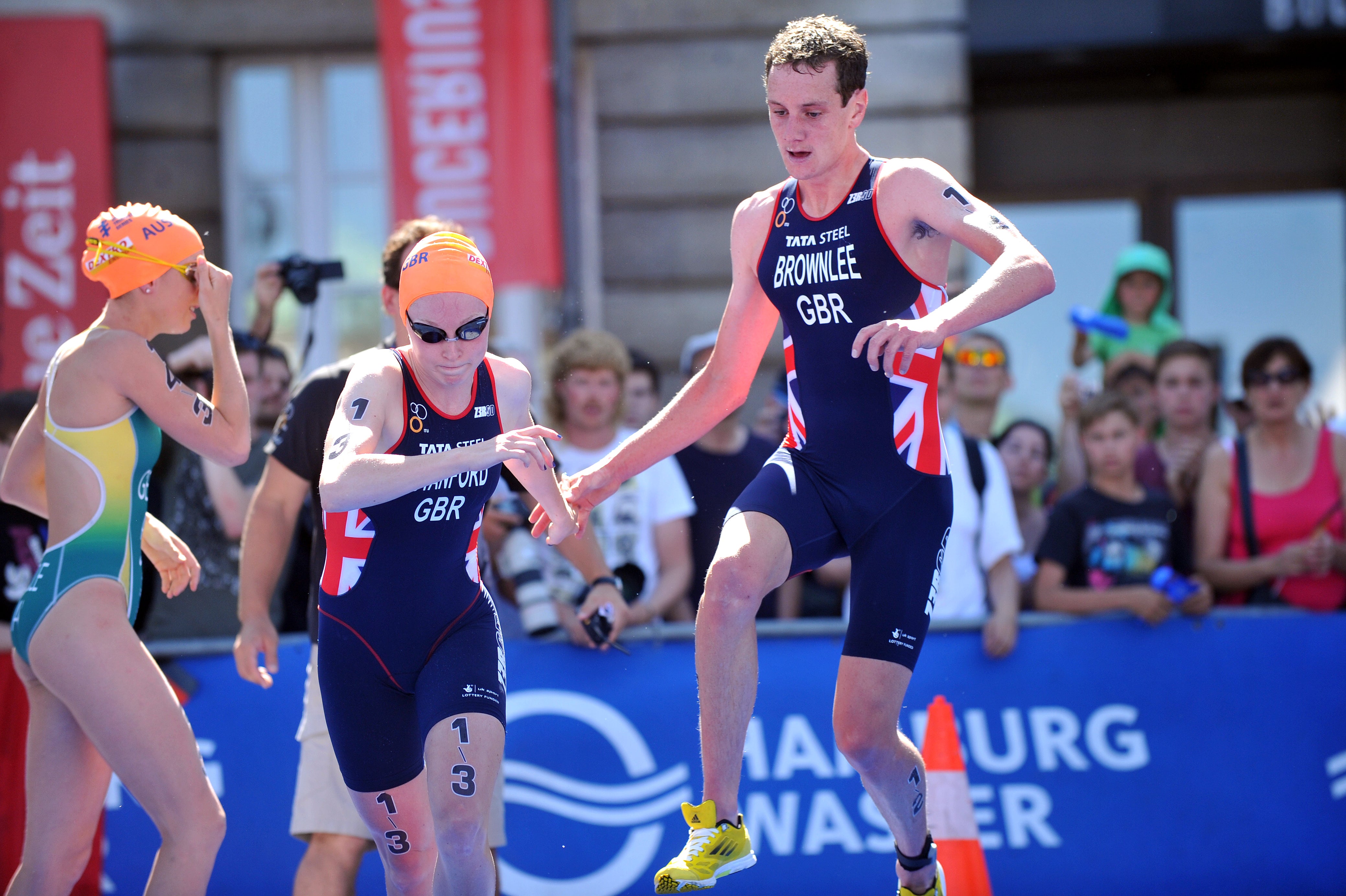 Alistair Brownlee tags Non Stanford to start the third relay leg of the race. Stanford later crashed on her bike. Photo: Triathlon.org