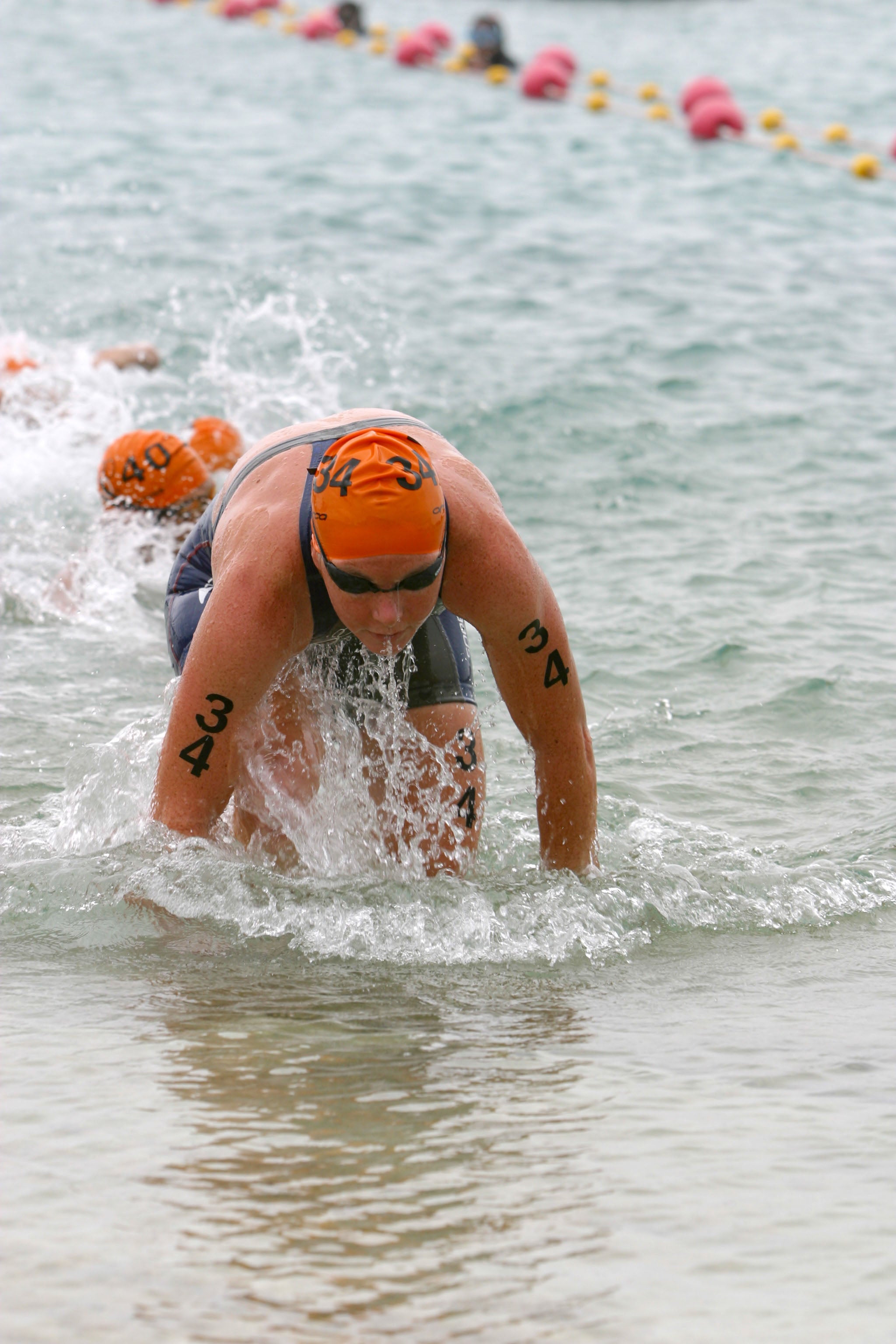 Sara McLarty exits teh water at an ITU race. Photo: Triathlon.org
