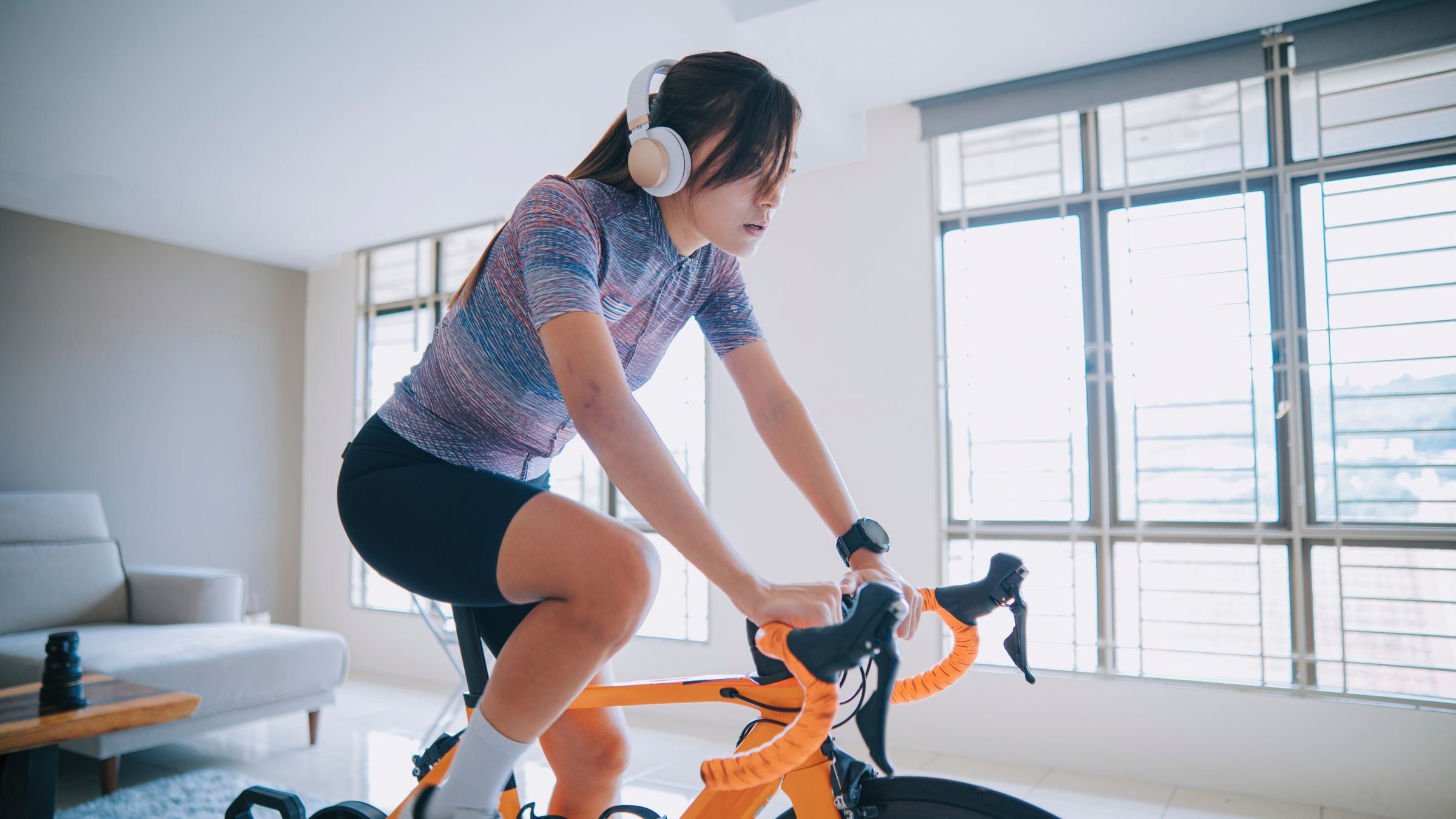 A triathlete does a bike trainer workout.