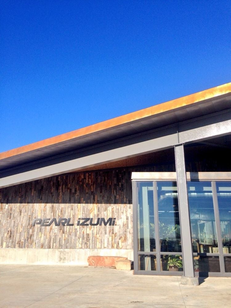 Pearl Izumi recently set up USA headquarters in a brand new eco-friendly building in Louisville, Colo., between Denver and Boulder. The building's aesthetic reflects the shapes and colors of the surrounding landscape, marked by the Flatirons in the distance.