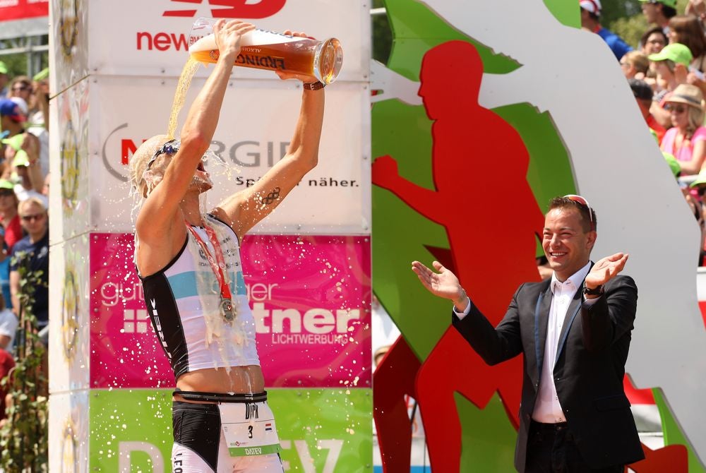 Challenge CEO Felix Walchshöfer watches 2013 Roth winner Dirk Bockel celebrate. Photo: Stephen Pond/Getty Images