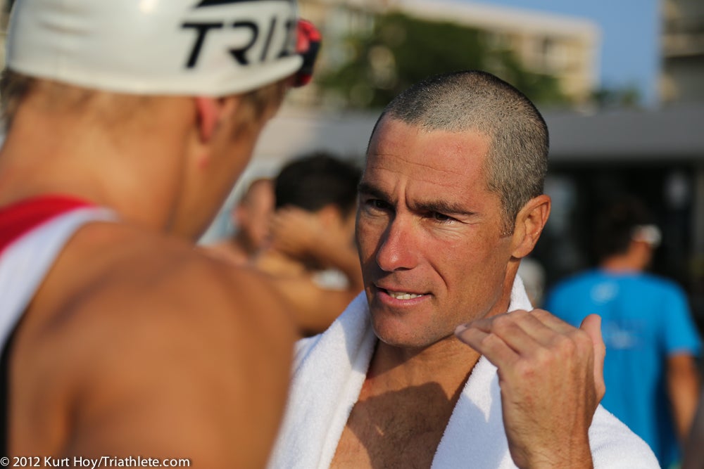 Craig Alexander chats with an athlete during Kona race week in 2012. Photo: Kurt Hoy