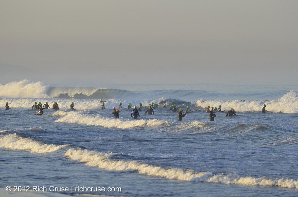 Athletes dive into the water at the 2012 SuperFrog Triathlon. Photo: Rich Cruse