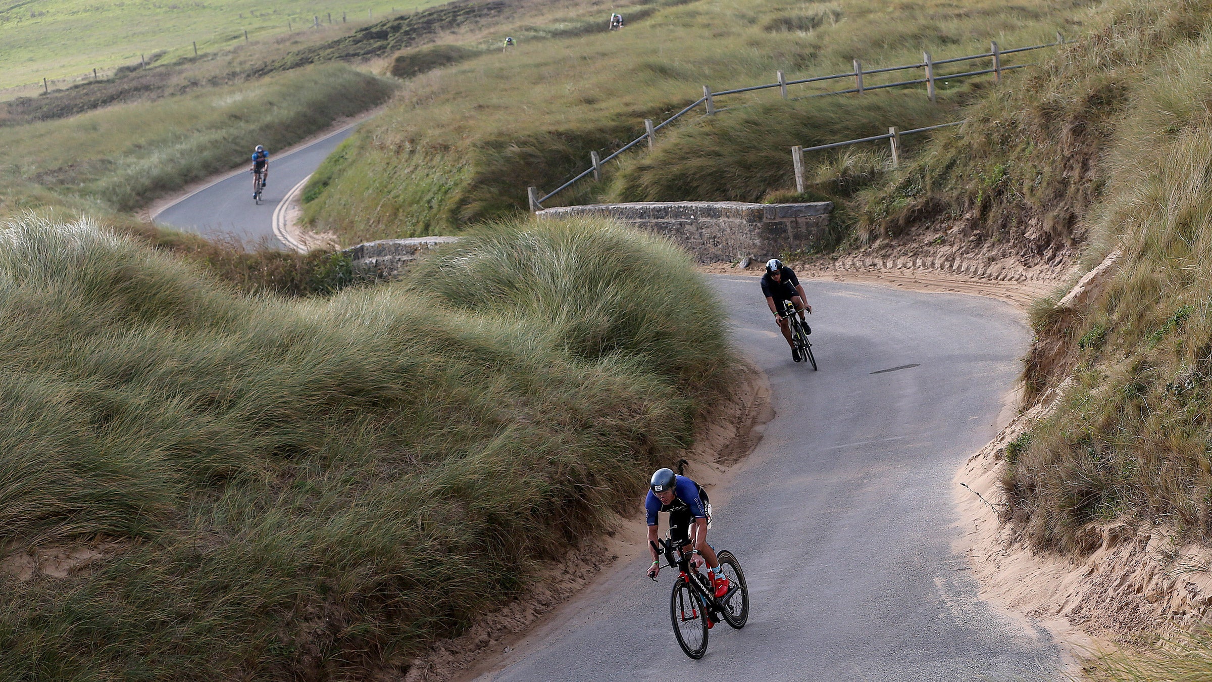 Athletes climb at Ironman Wales.