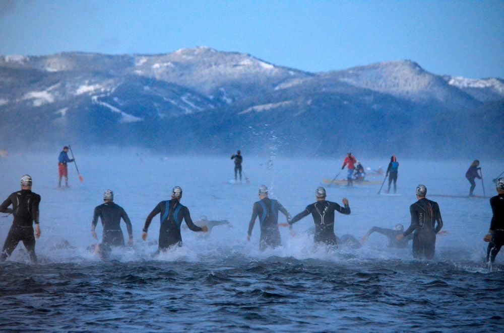 Athletes enter chilly waters to start the 2013 race. Photo: Susan Lacke