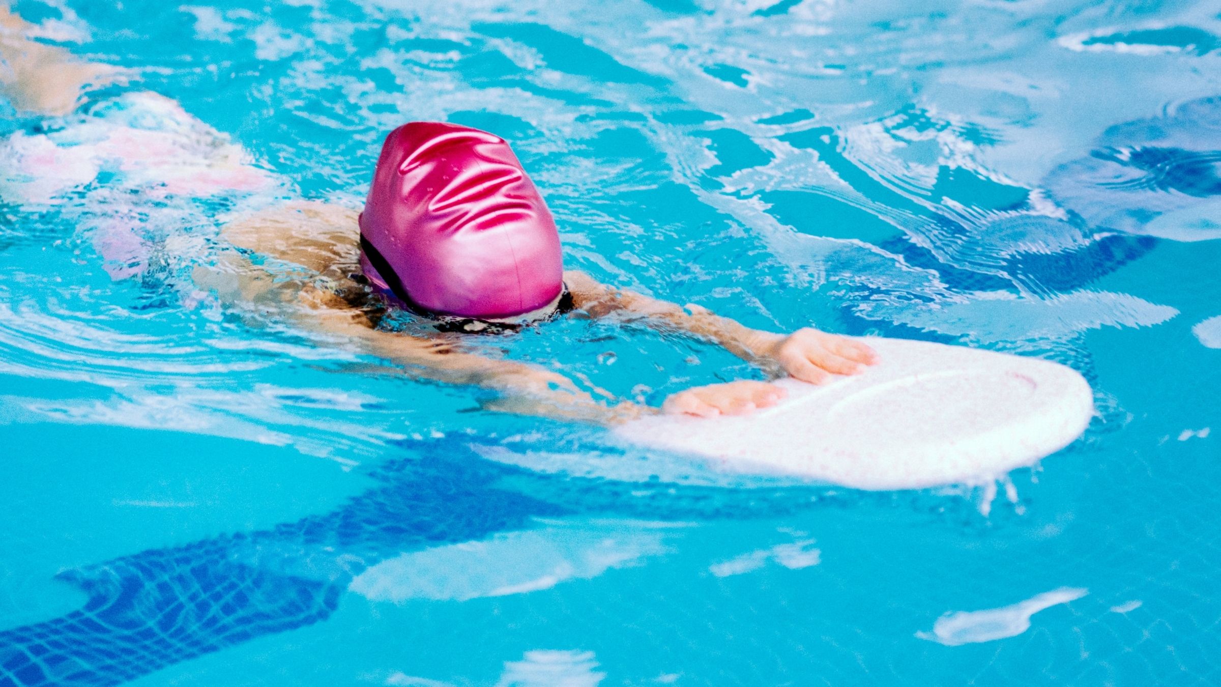 A swimmer does a swim kick workout
