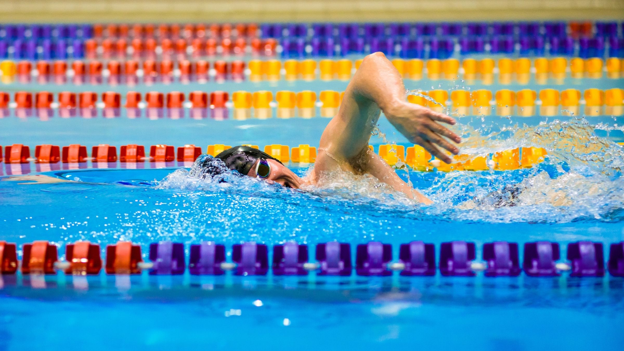 A triathlete does a swim band workout.