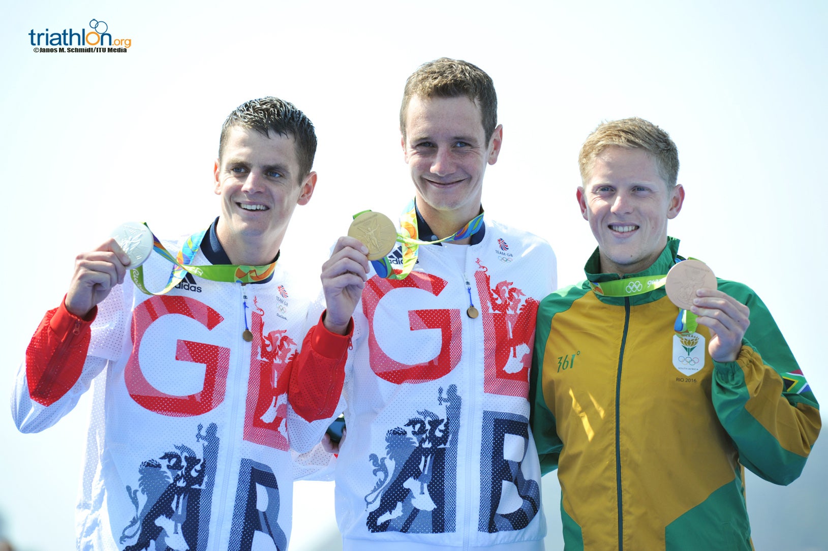 Schoeman on the podium with Jonathan Brownlee (silver) and Alistair Brownlee (gold). Photo: Janos Schmidt/Triathlon.org