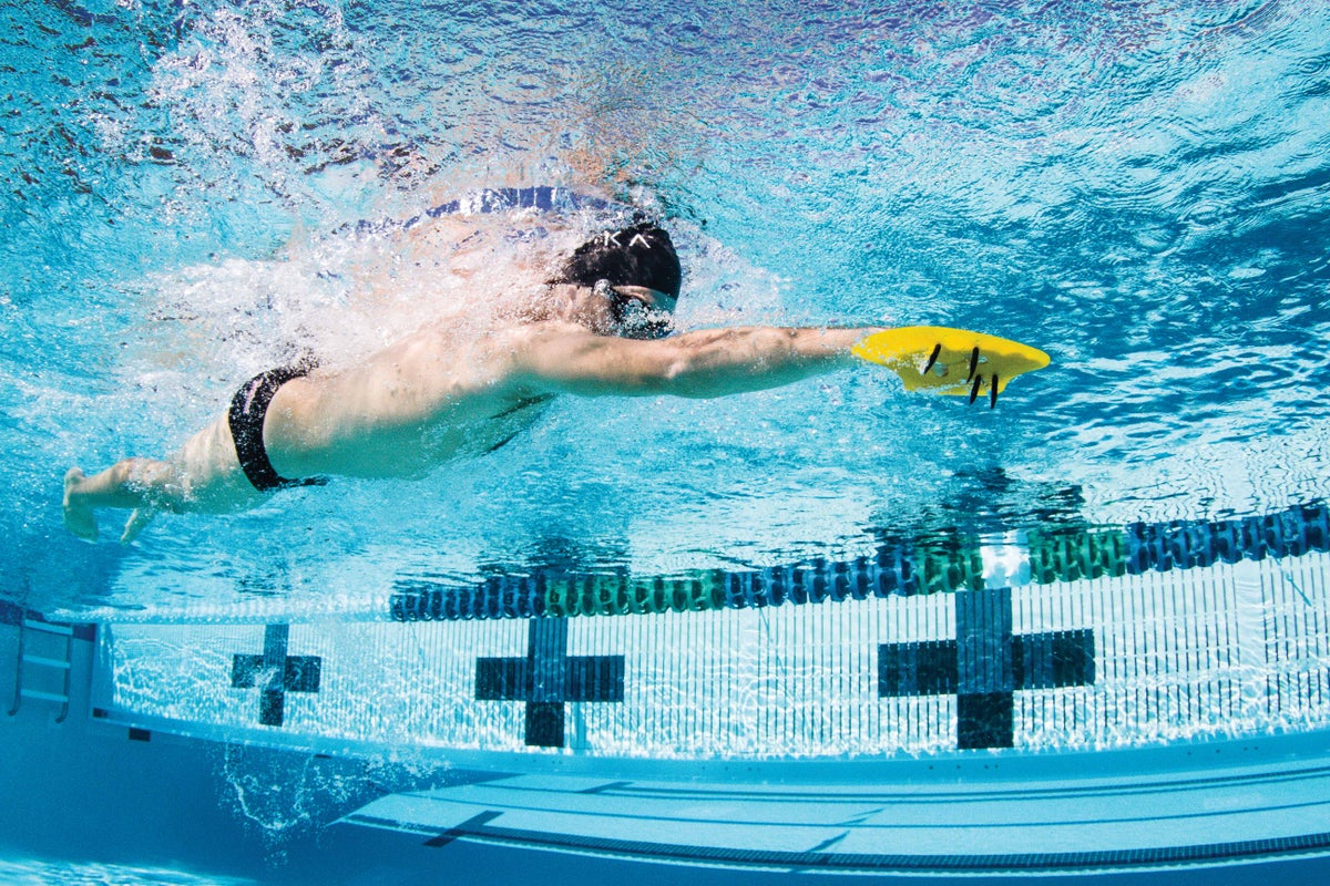The Proper Way To Add Paddles To Your Swim Training Triathlete
