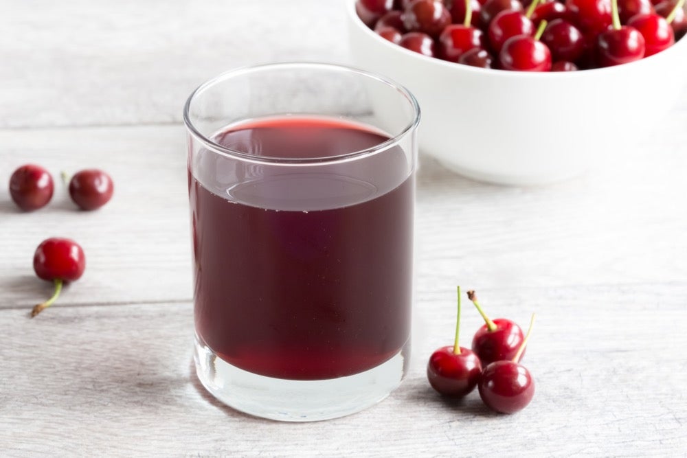 Image shoes tart cherry juice in a glass as endurance athletes use it for performance and recovery.