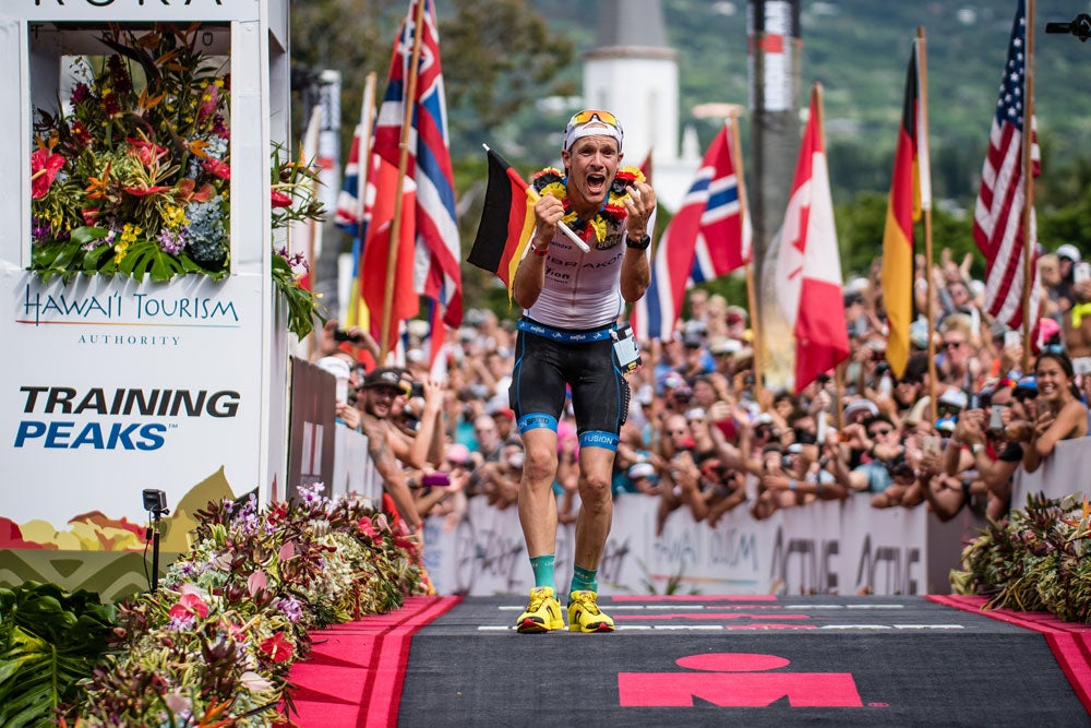 Patrick Lange crosses the finish line in Kona. Photo: Oliver Baker