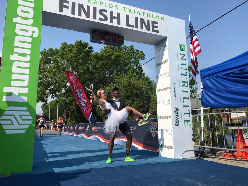 The couple crosses the finish line as husband and wife. Photo: Cody Crowther/USA Triathlon