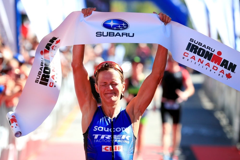 Linsey Corbin celebrates after crossing the finish line at Ironman Canada. Photo: Tom Pennington/Getty Images for IRONMAN