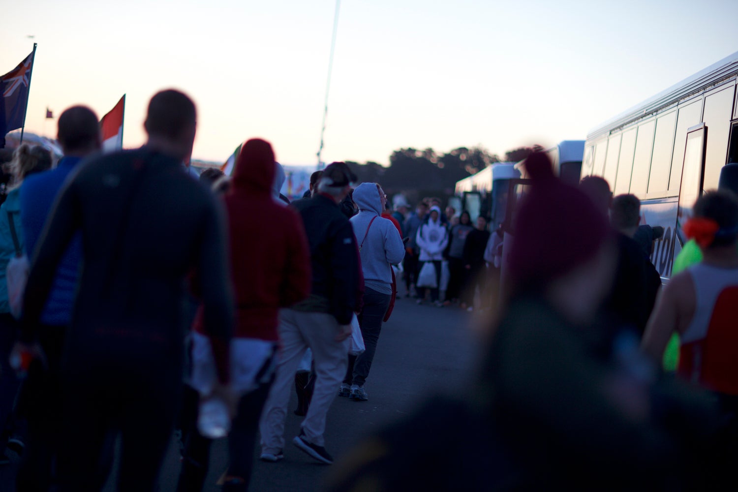 Athletes line up to get back on the busses after the cancelled Escape From Alcatraz swim. Photo: Rocky Arroyo