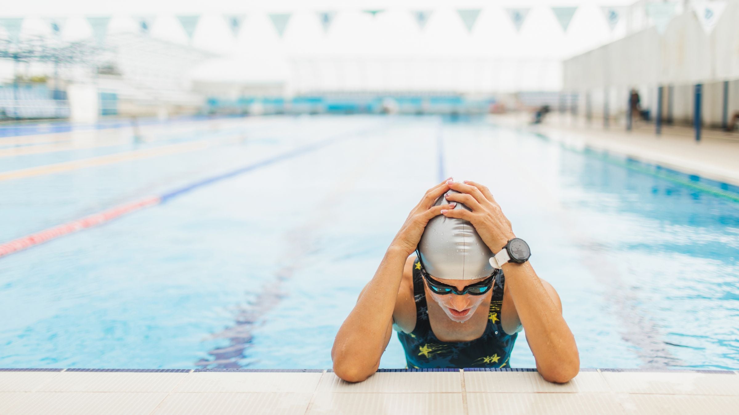 A swimmer is frustrated in the pool.