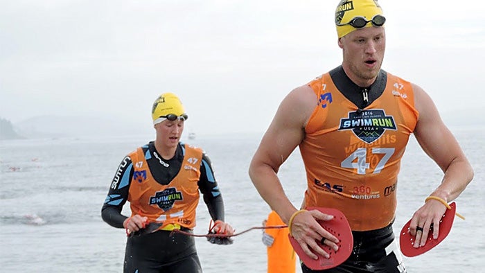 Two athletes compete in a swimrun endurance event. You can too when you learn how to train for one using Triathlete's guide.