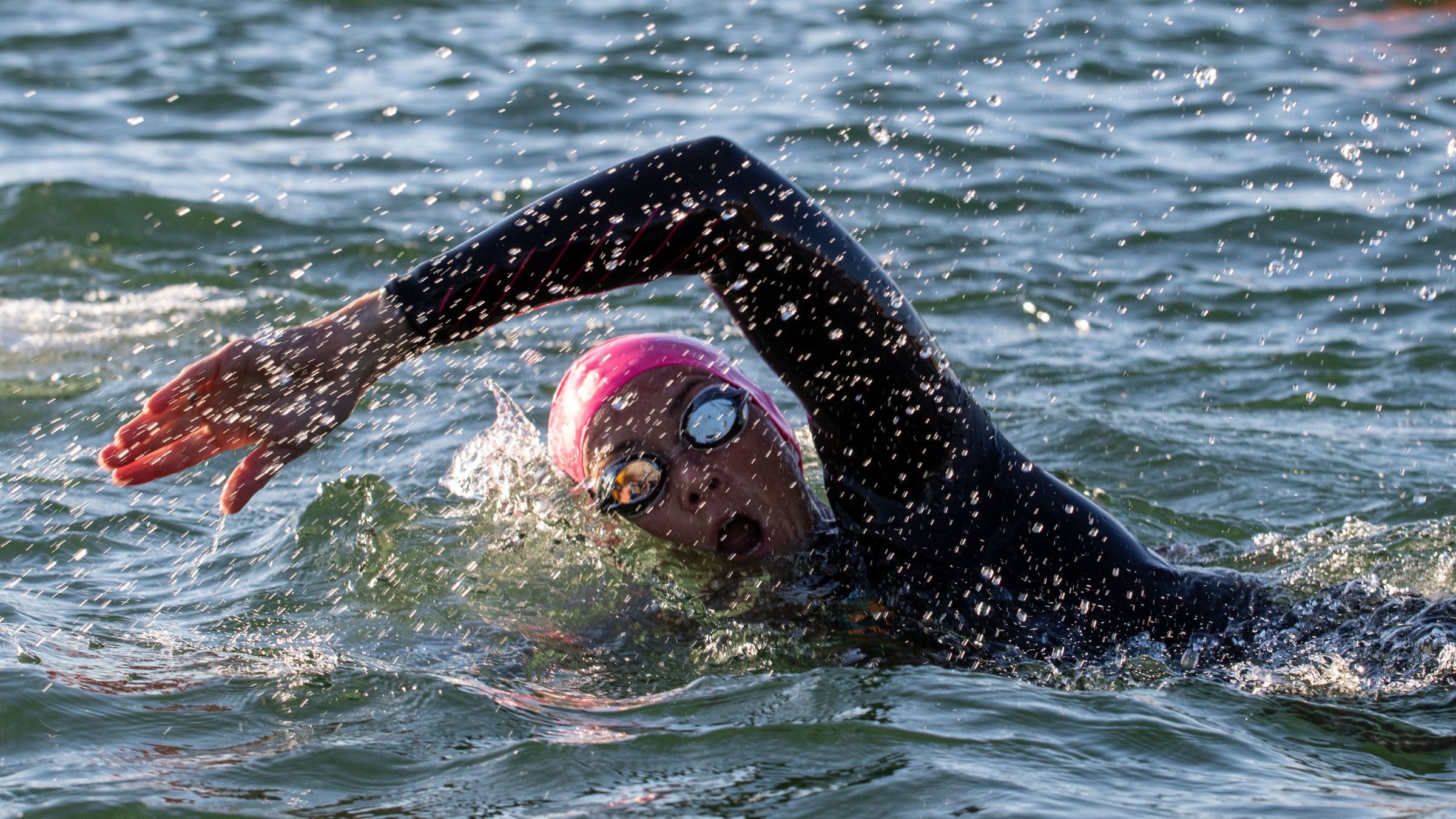 A swimmer demonstrates bilateral breathe for triathlon