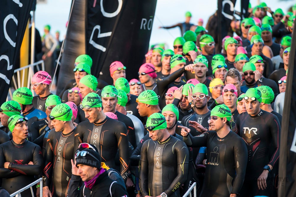 The plan for 2018 was for athletes to dive in for a beach start, but based on surf forecasts race directors decided to return to the original harbor swim. Photo: Paul Phillips/Competitive Image/<a href=http://twitter.com/compimagephoto>@Compimagephoto</a>