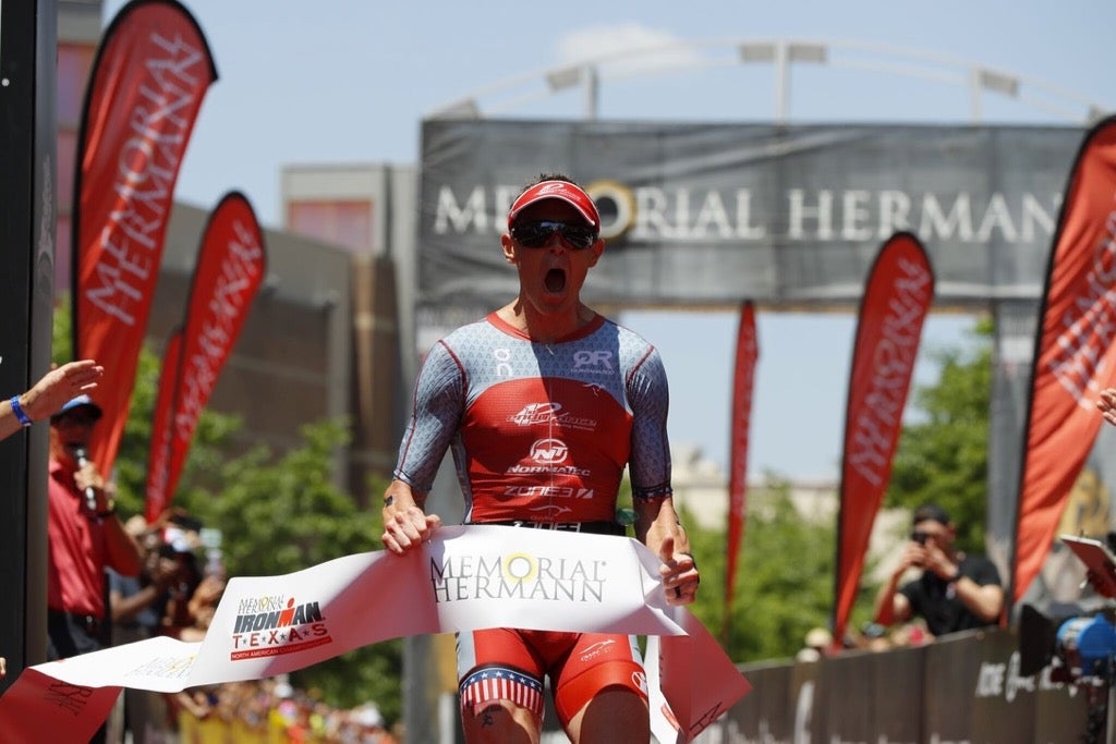 Matt Hanson crosses the finish line in a record-breaking 7:39:25 at Ironman Texas in 2018.