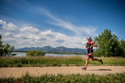Jodie Swallow fights hard on the run in Boulder with the Flatirons in the distance