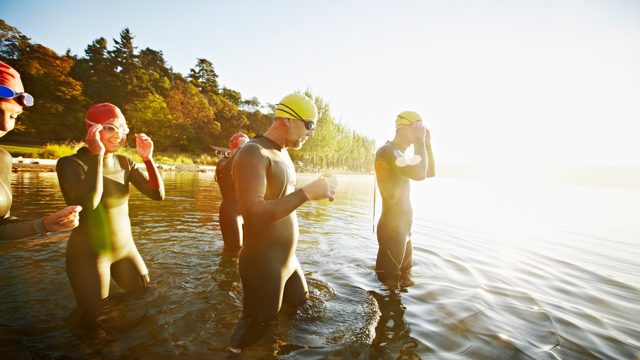 Triathletes swim in the best triathlon wetsuits for beginners