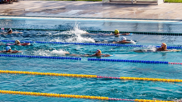 Athletes choose a lane at Masters swimming