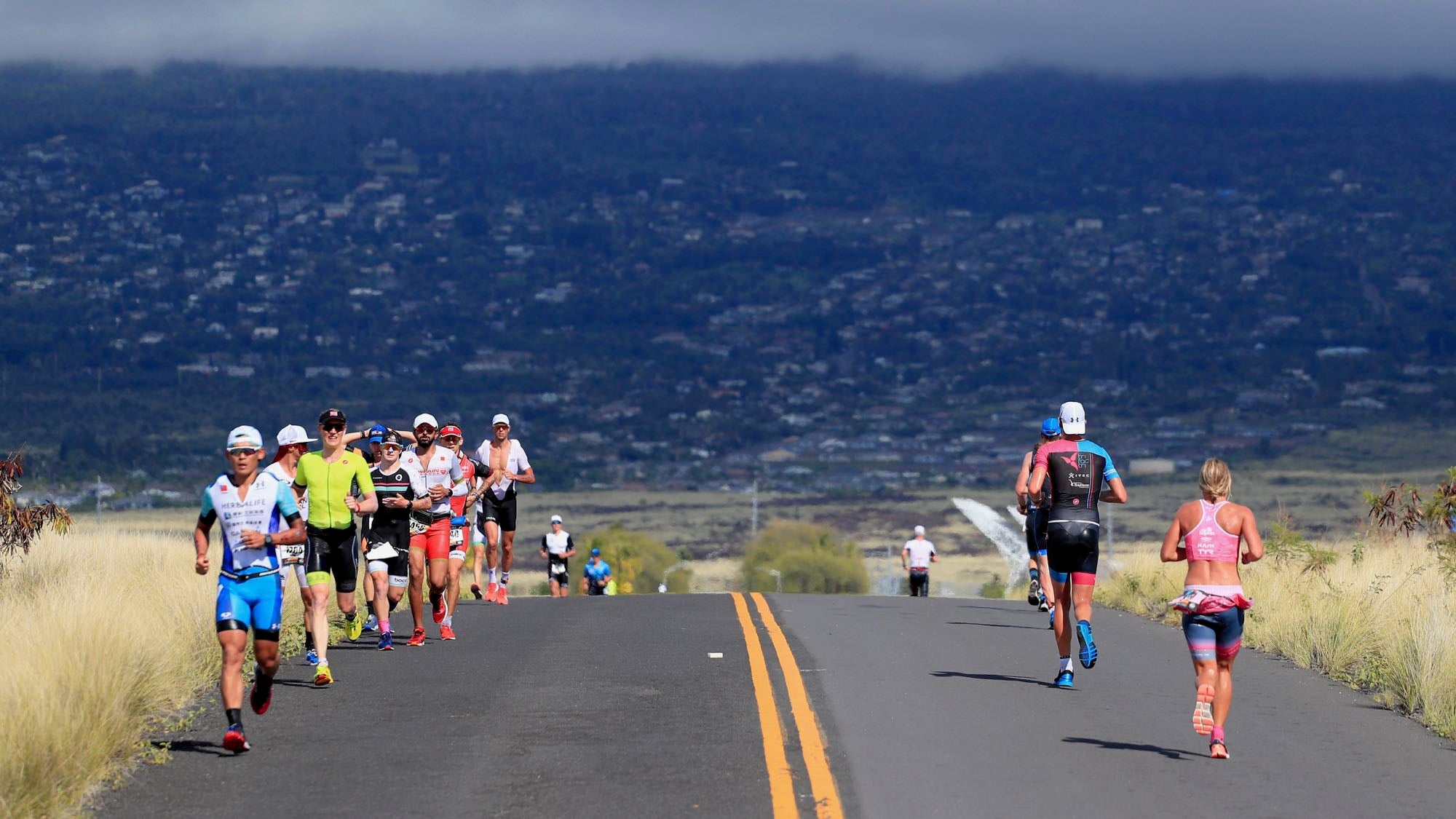 KAILUA KONA, HI - OCTOBER 13:  Runners compete during the IRONMAN World Championships brought to you by Amazon on October 13, 2018 in Kailua Kona, Hawaii.  (Photo by Tom Pennington/Getty Images for IRONMAN)
