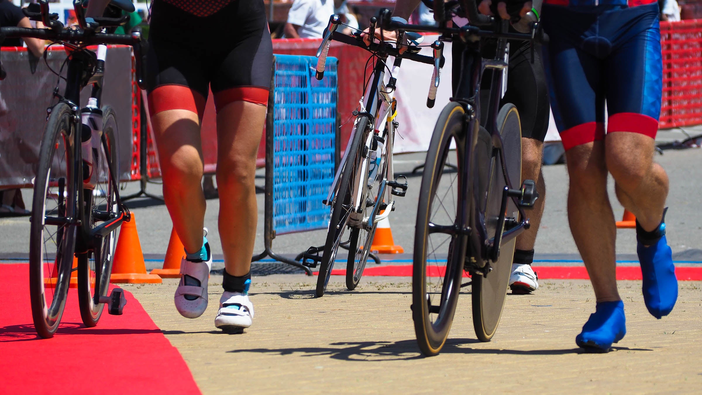 Group of people running in triathlon transition