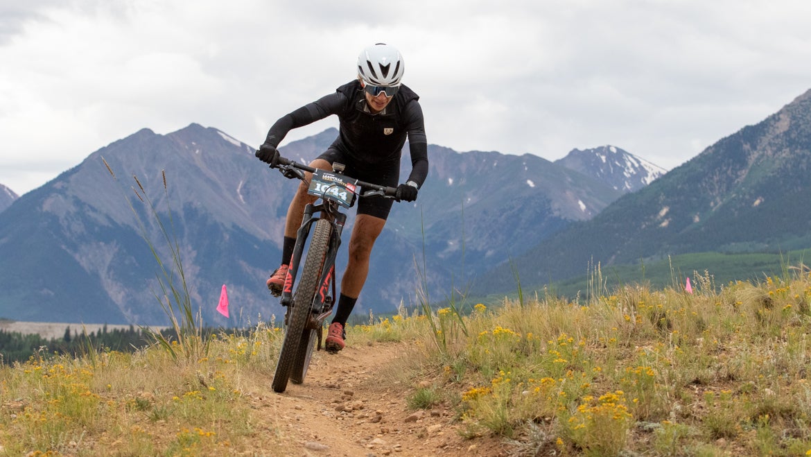 Woman riding her mountain bike over the Leadville 100 course at altitude