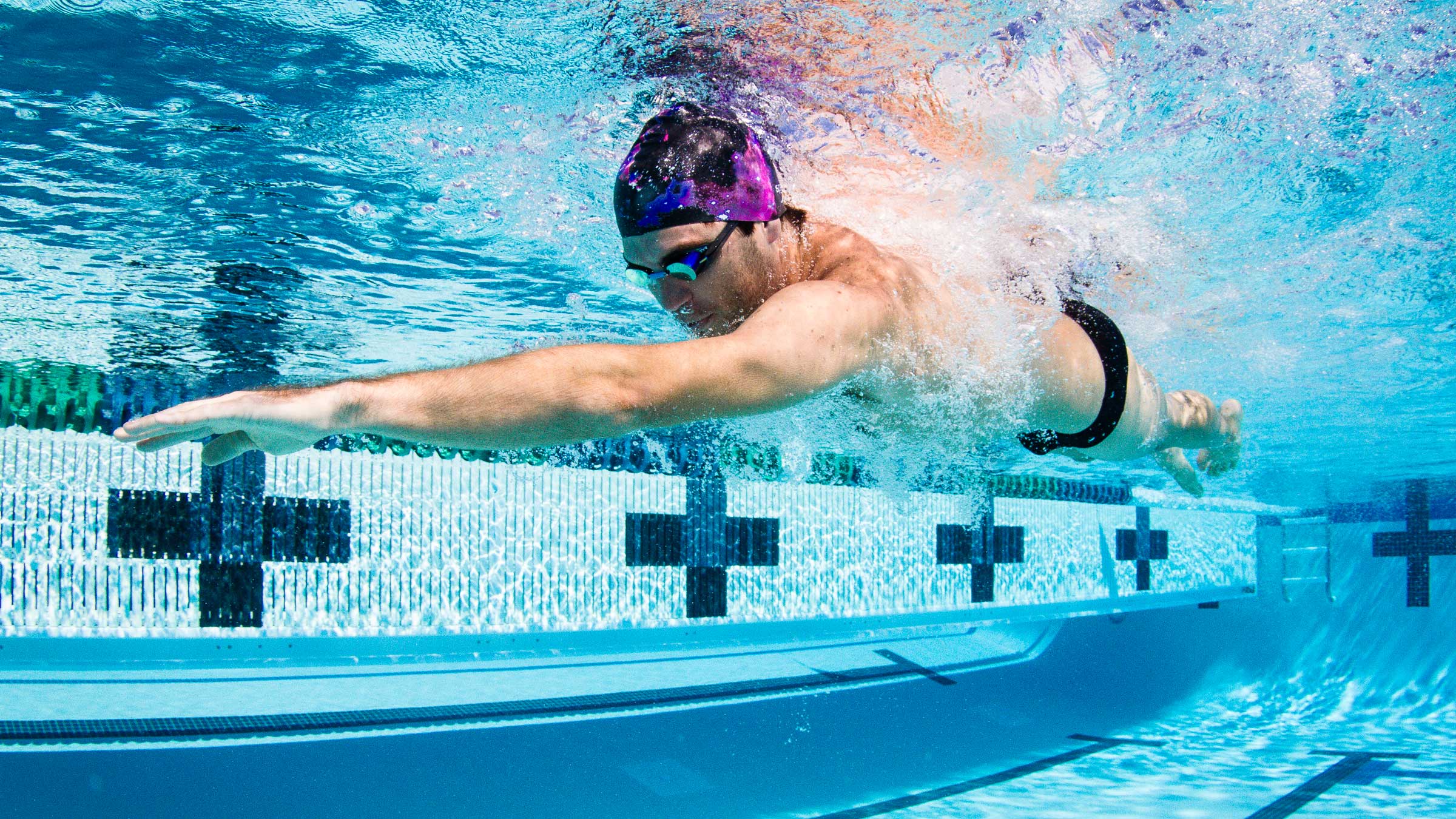 An athlete training for triathlon completes new swim drills from coach Sara McClarty during a Weekend Swim Workout.