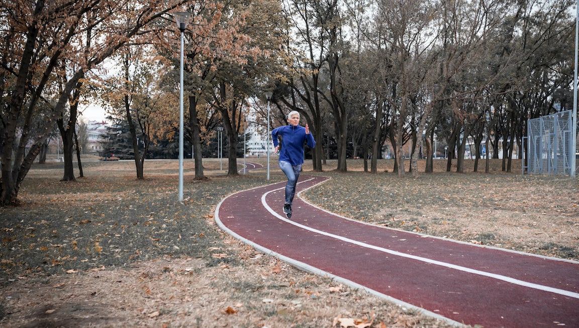 Active senior woman enjoying a healthy lifestyle, doing strides, and living her best life.