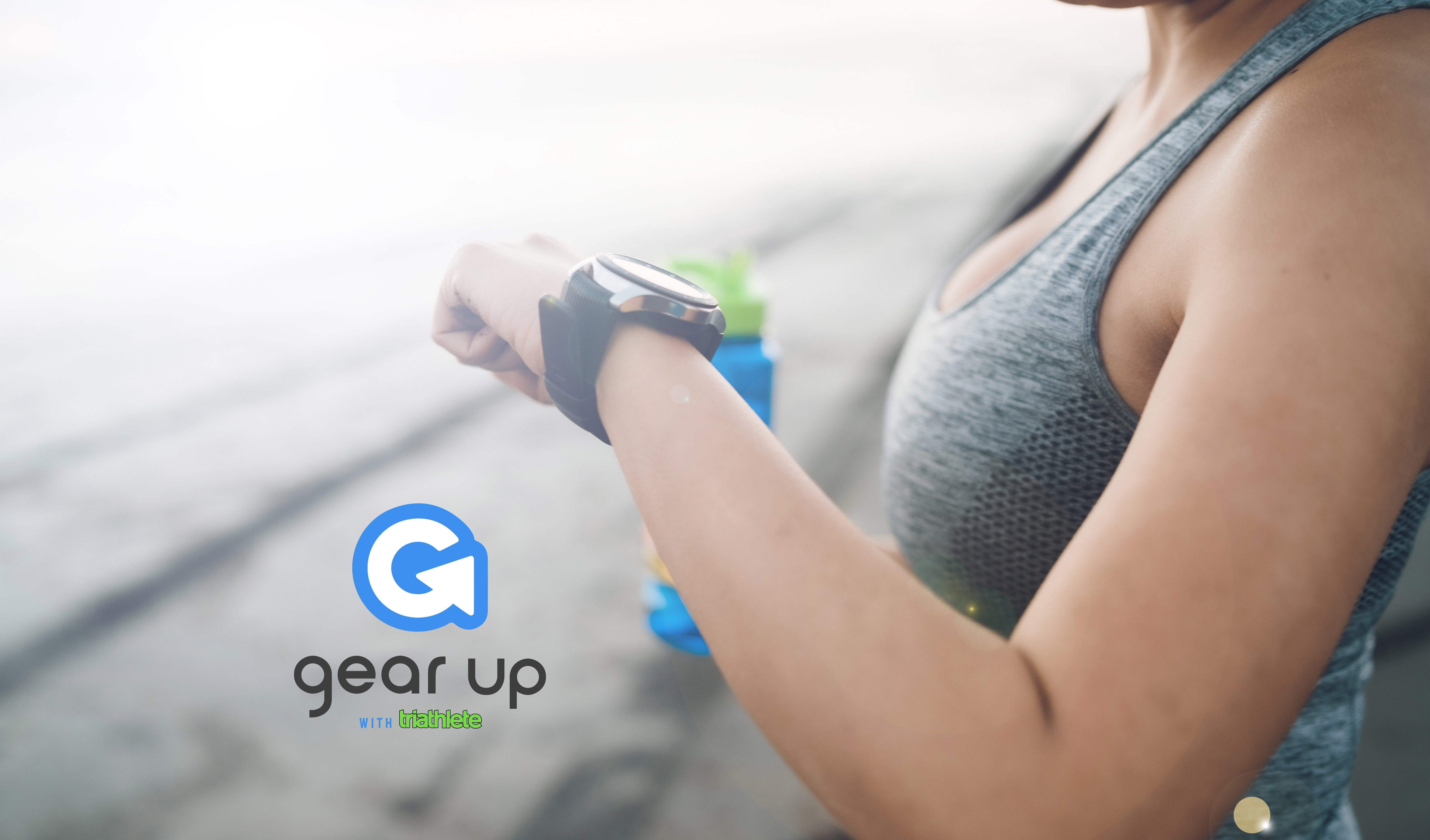 Woman using performance tracker to track her heart rate.