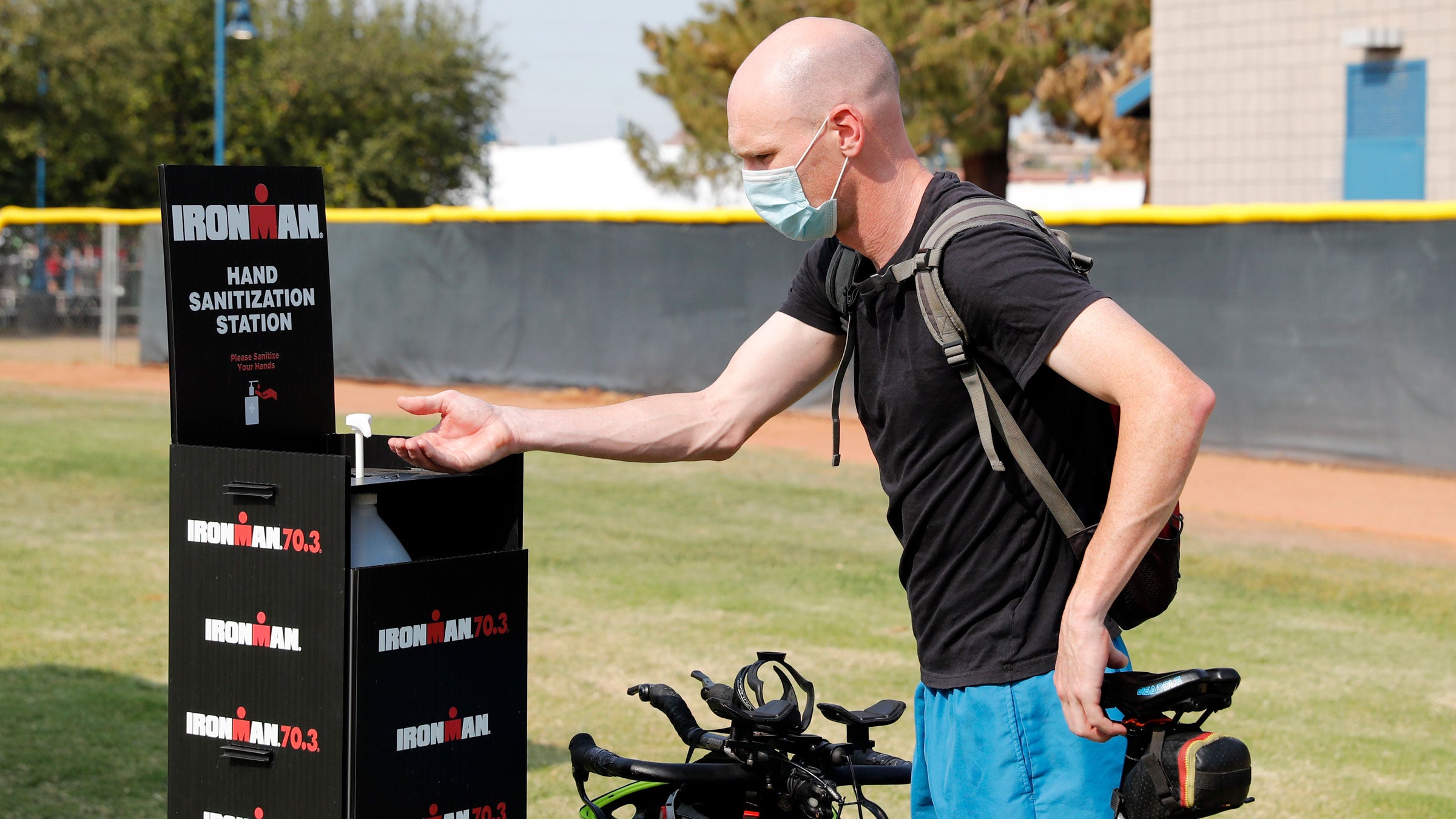 An athlete races a triathlon during the pandemic.