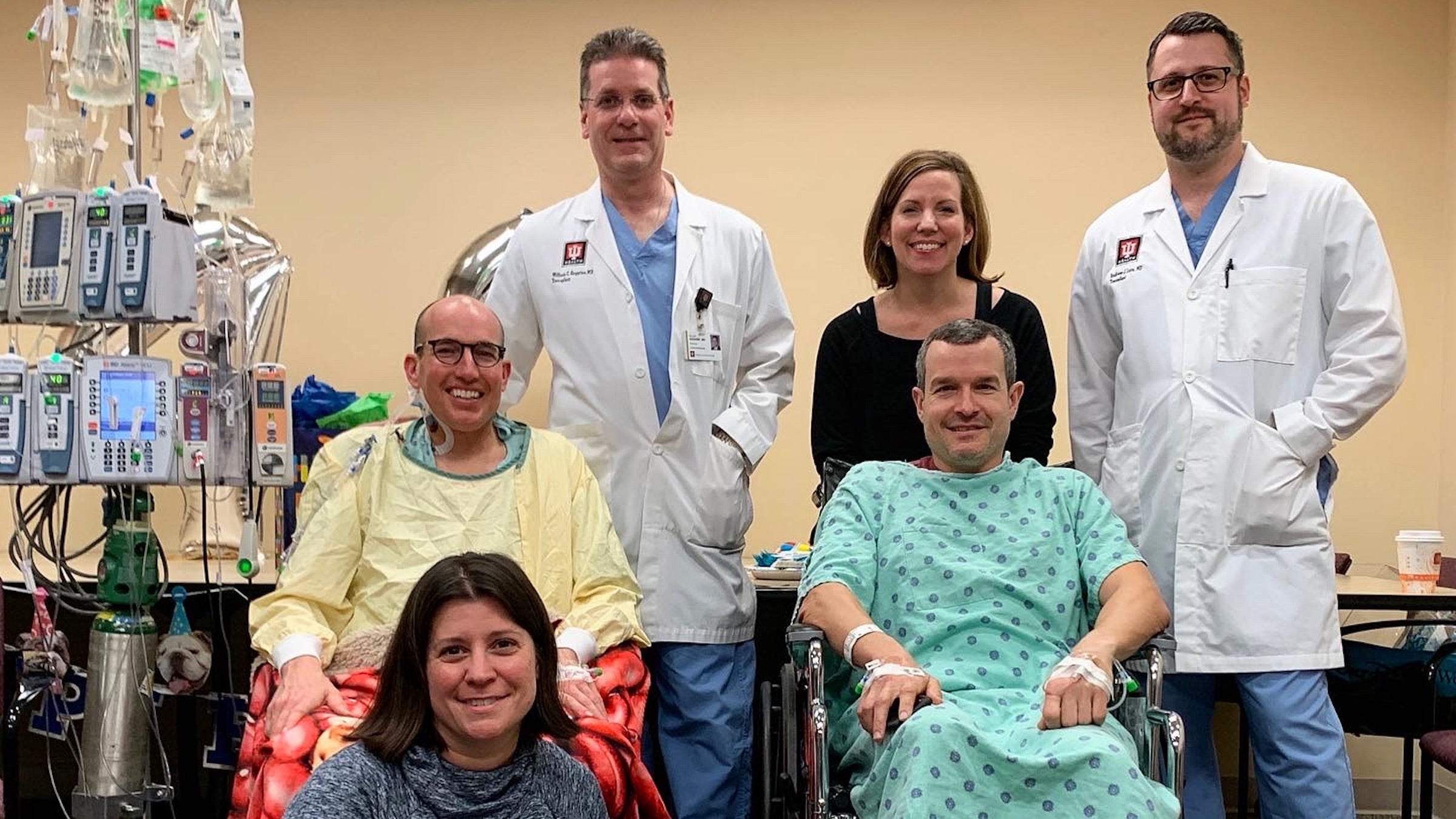 Michael Kaltenmark with his brother, Doug, and medical team. 
