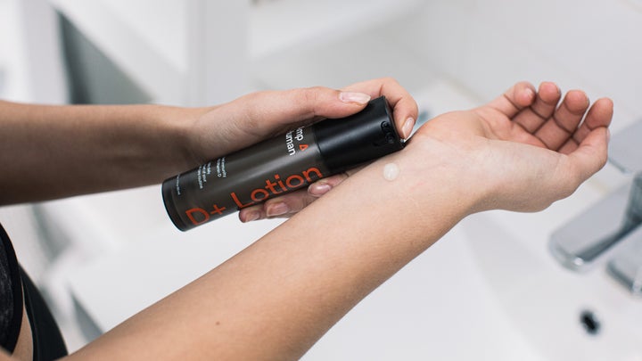Close-up of vitamin D lotion applied on a woman's wrist
