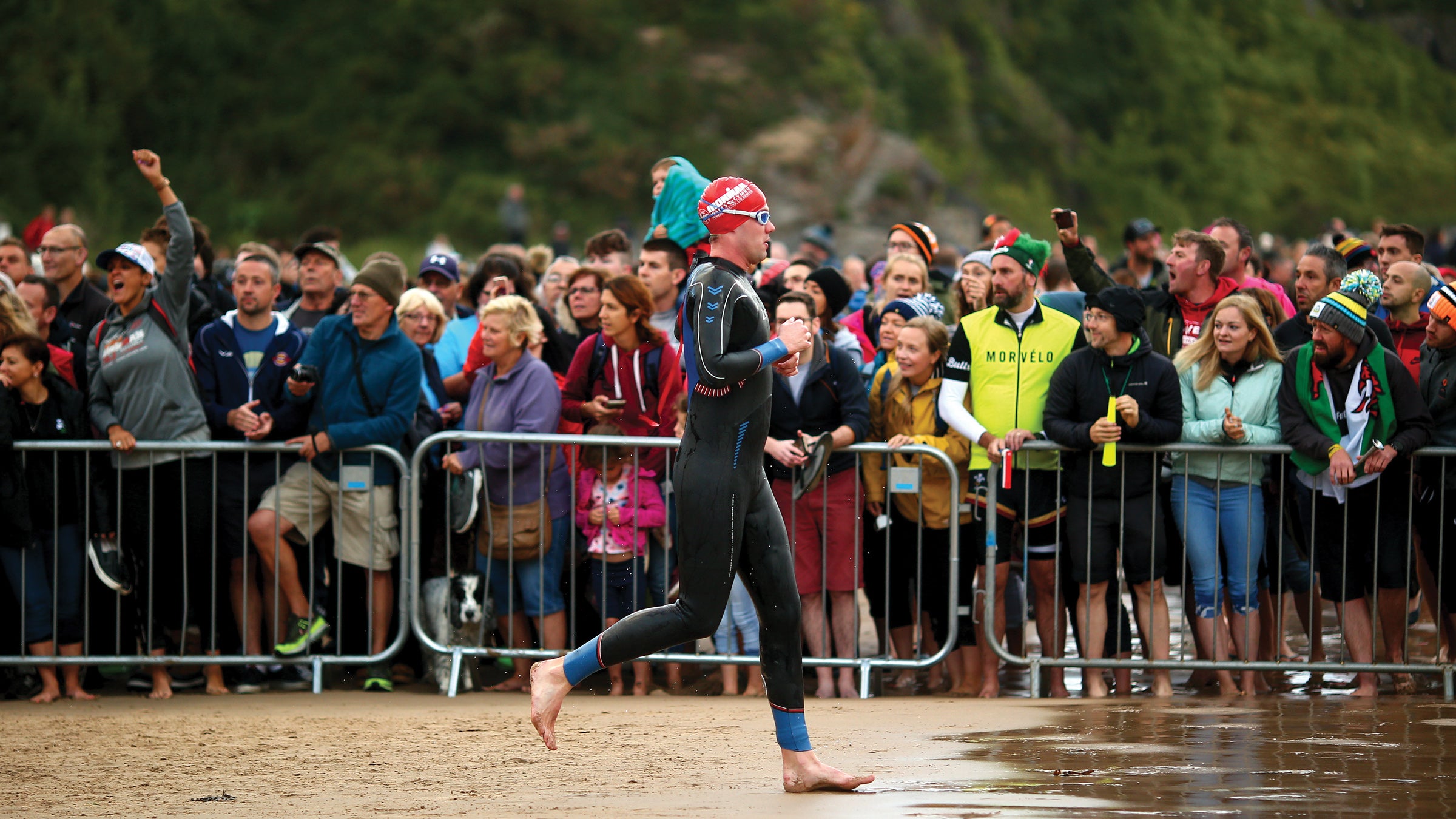 An athlete begins his day at Ironman Wales, a race that has helped inspire the community that hosts it.