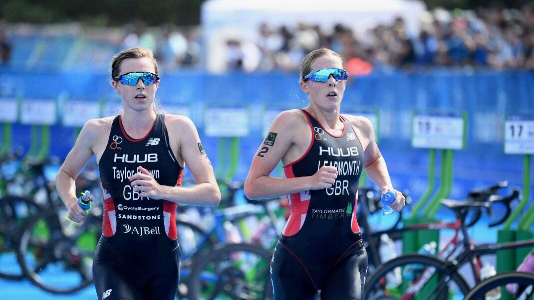 Triathletes Jess Learmonth and Georgia Taylor-Brown run side by side.