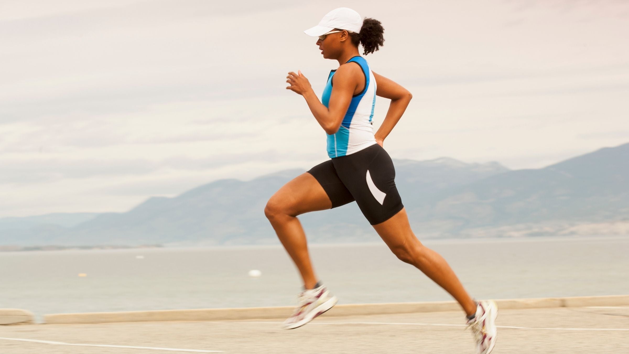 A woman running. Adaptations are when the body responds to training stress like running.