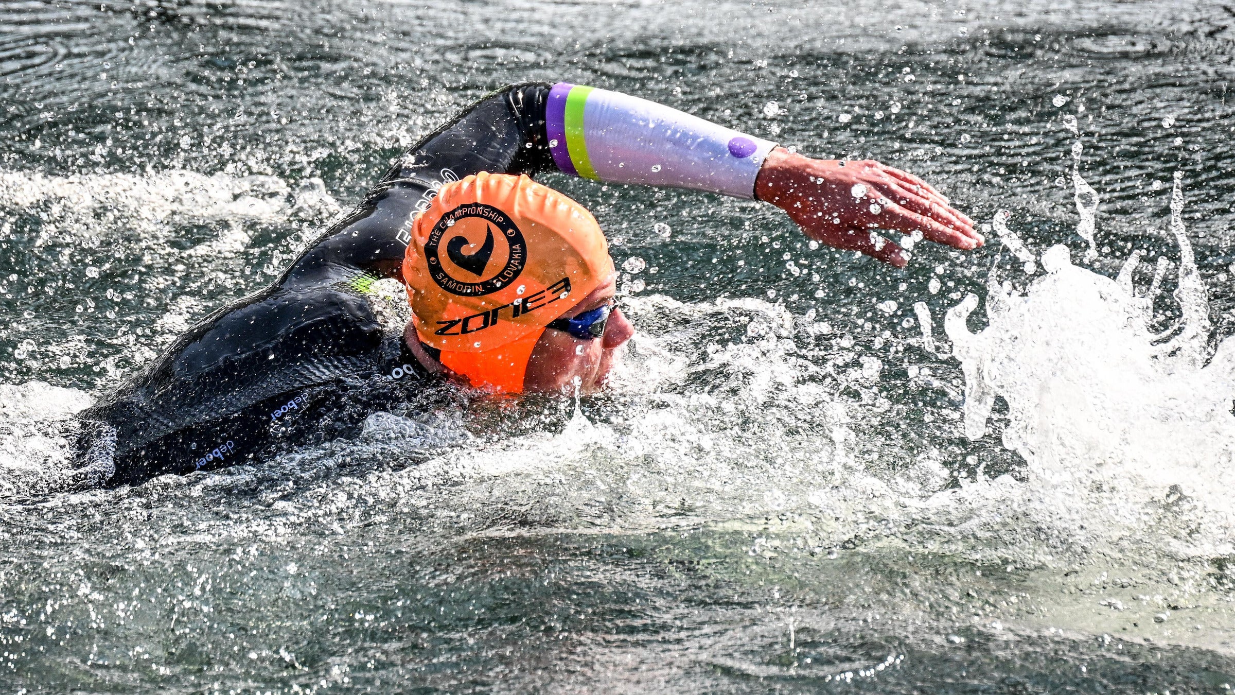 An athlete during a Challenge Family race who has mastered how to sight in open water.