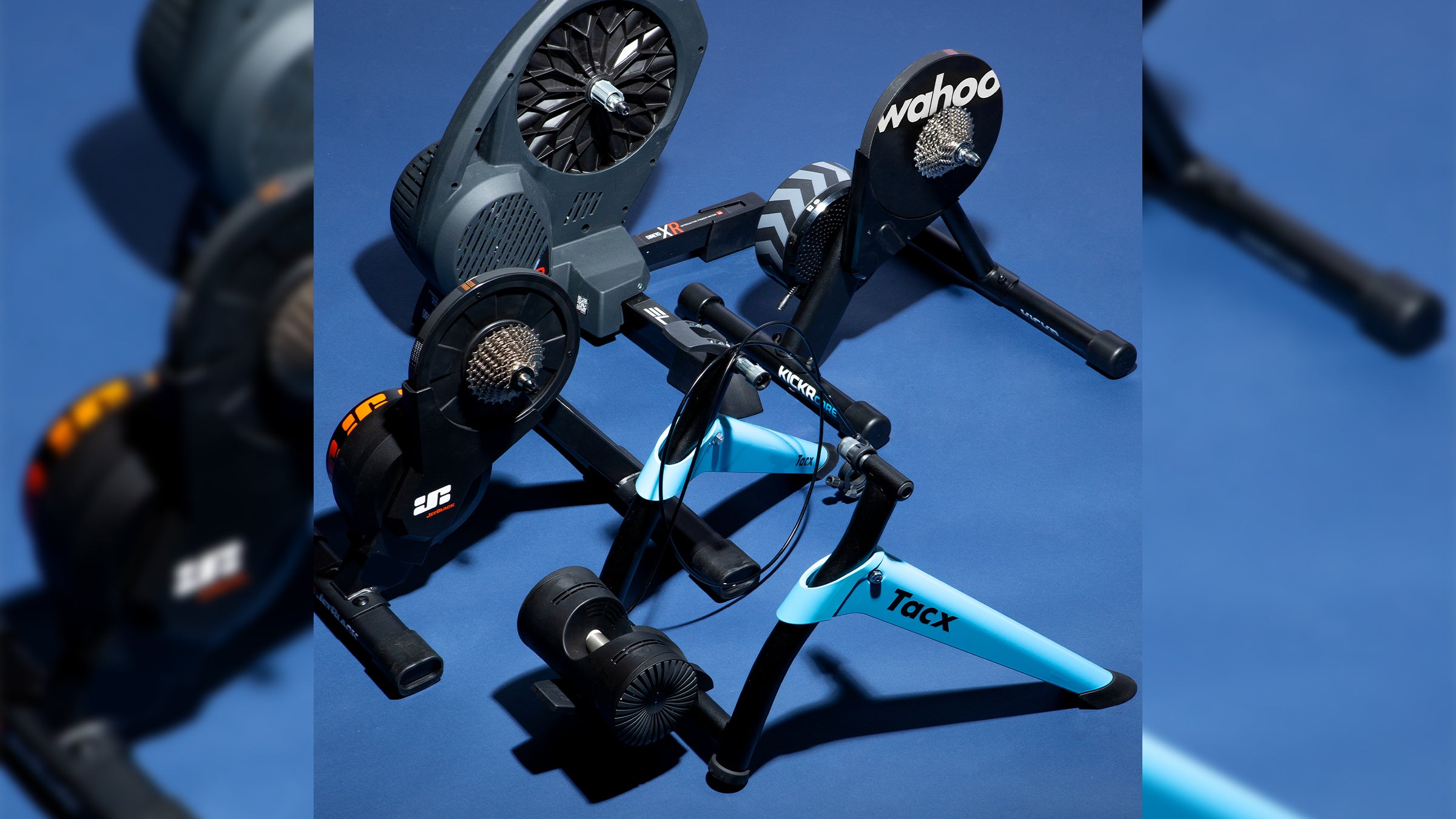 Smart indoor cycling trainers on blue background