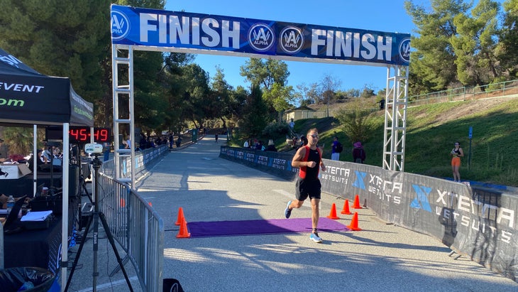 We Gave A Total Newbie $600 (And Six Weeks) For His First Triathlon – Triathlete 3 FINISH LINE PIC