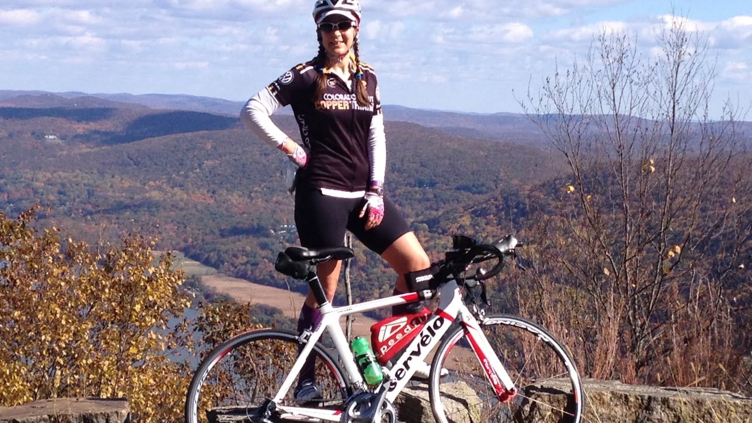Emily with her old bike, Justin.