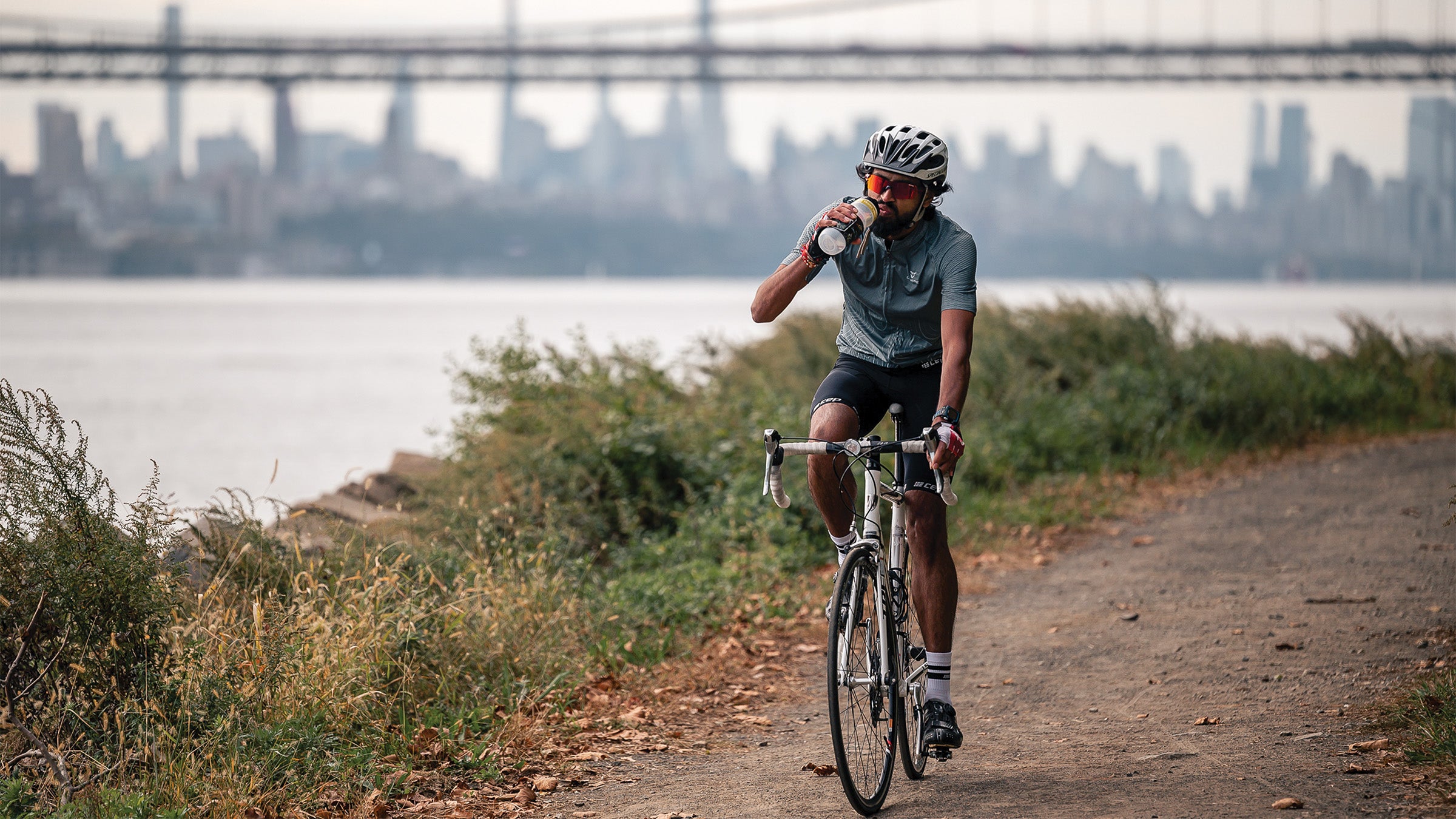 Athlete hydrating while on a bike ride
