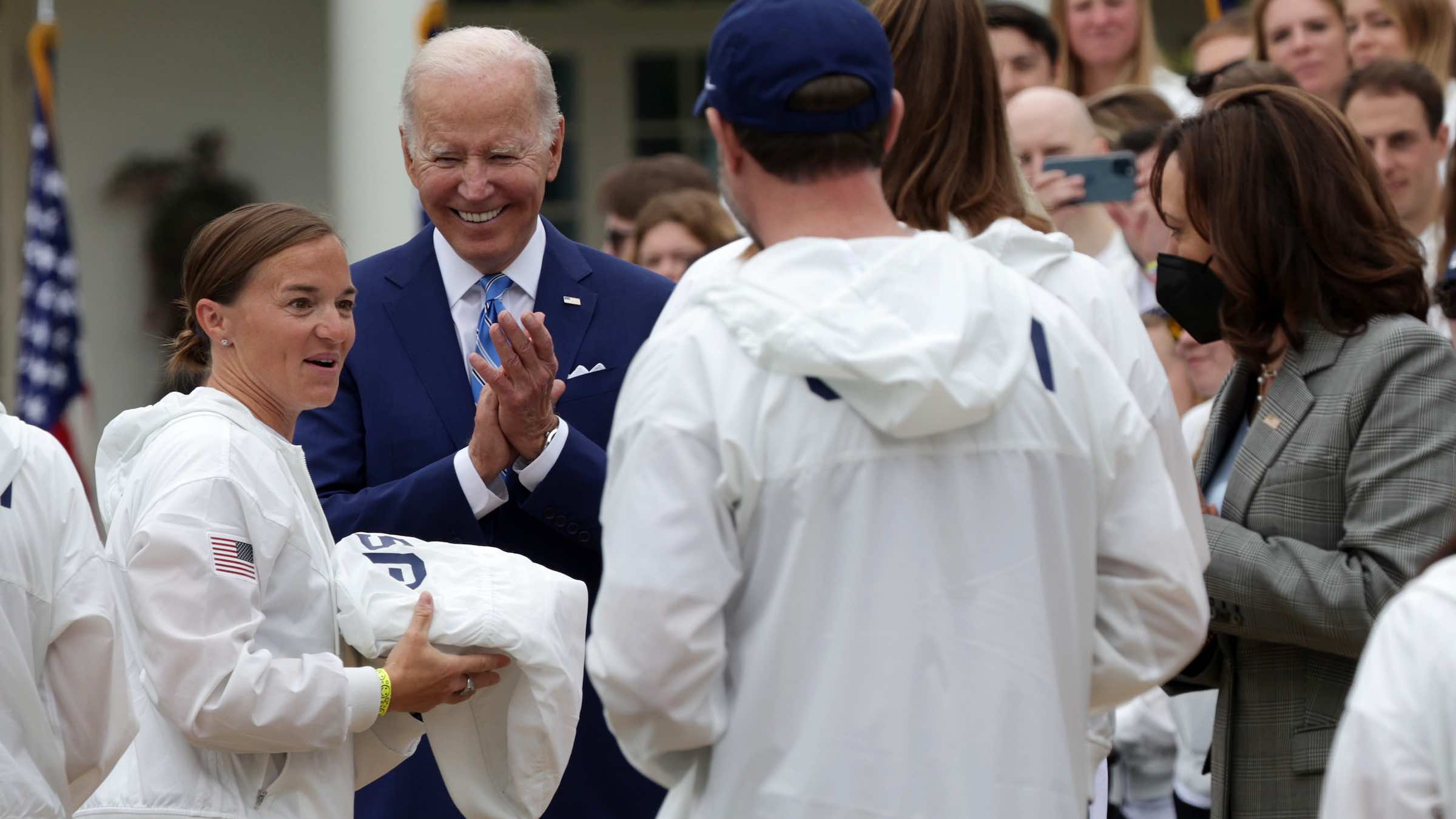 Paratriathlete Melissa Stockwell is greeted by President Biden and Vice President Harris.