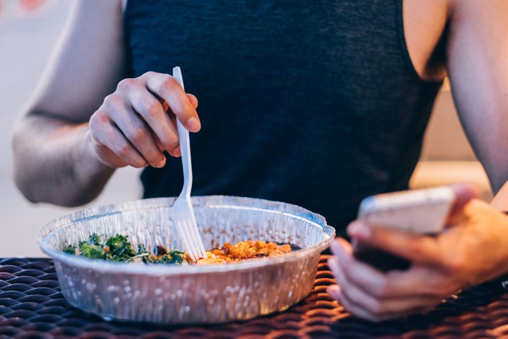 A man eats to carb-load before a race.