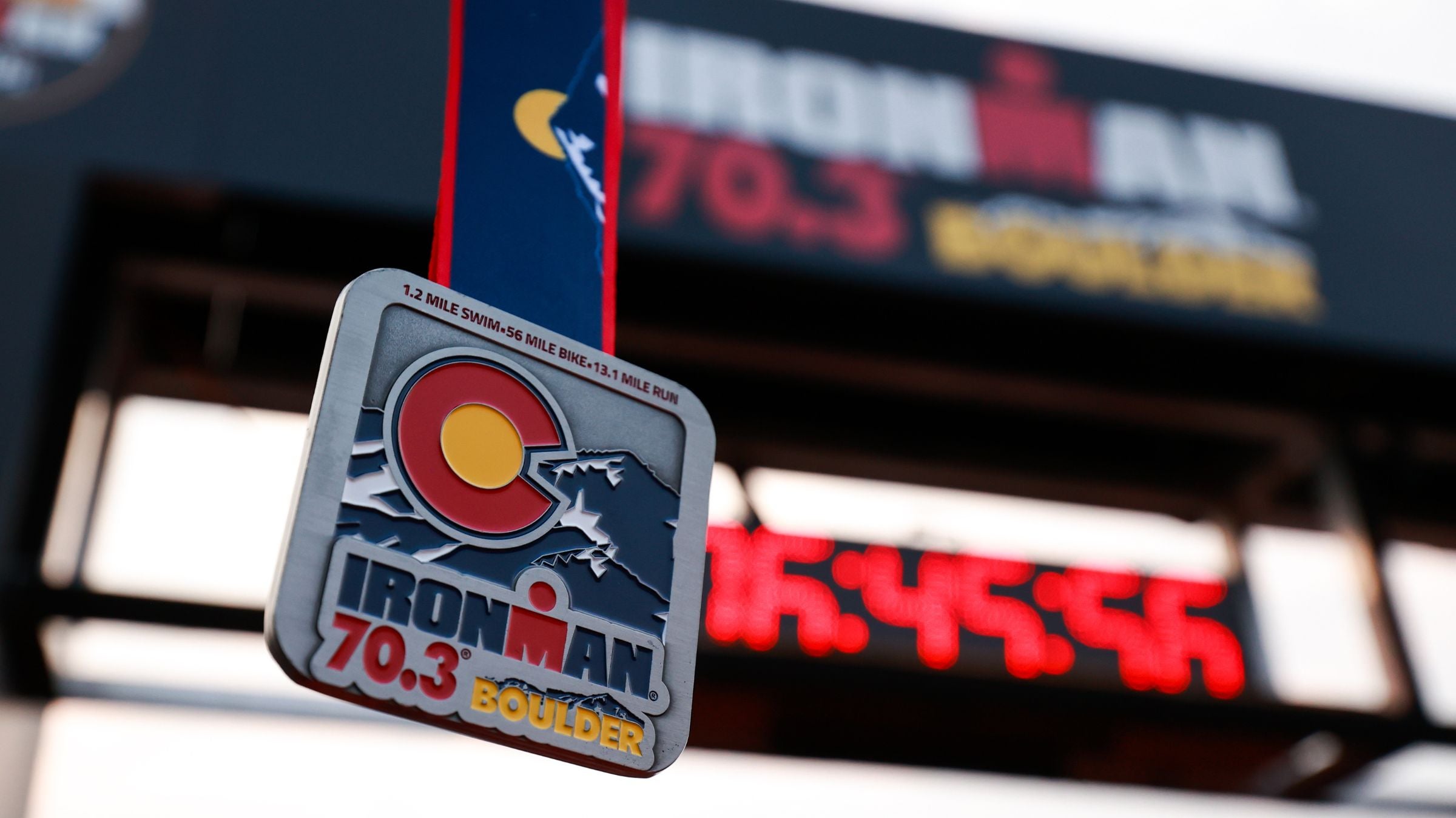 The finishers medal from how to watch Ironman 70.3 boulder