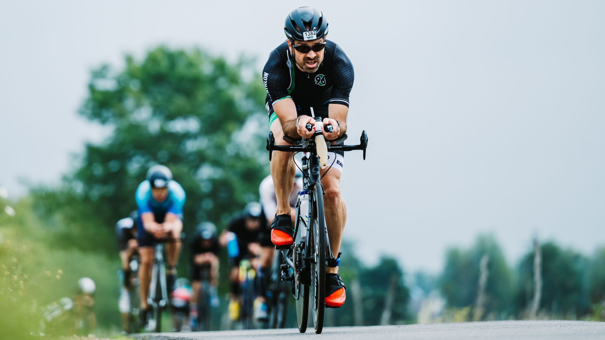 An athlete rides in a comfortable yet efficient aero position for better triathlon bike times.