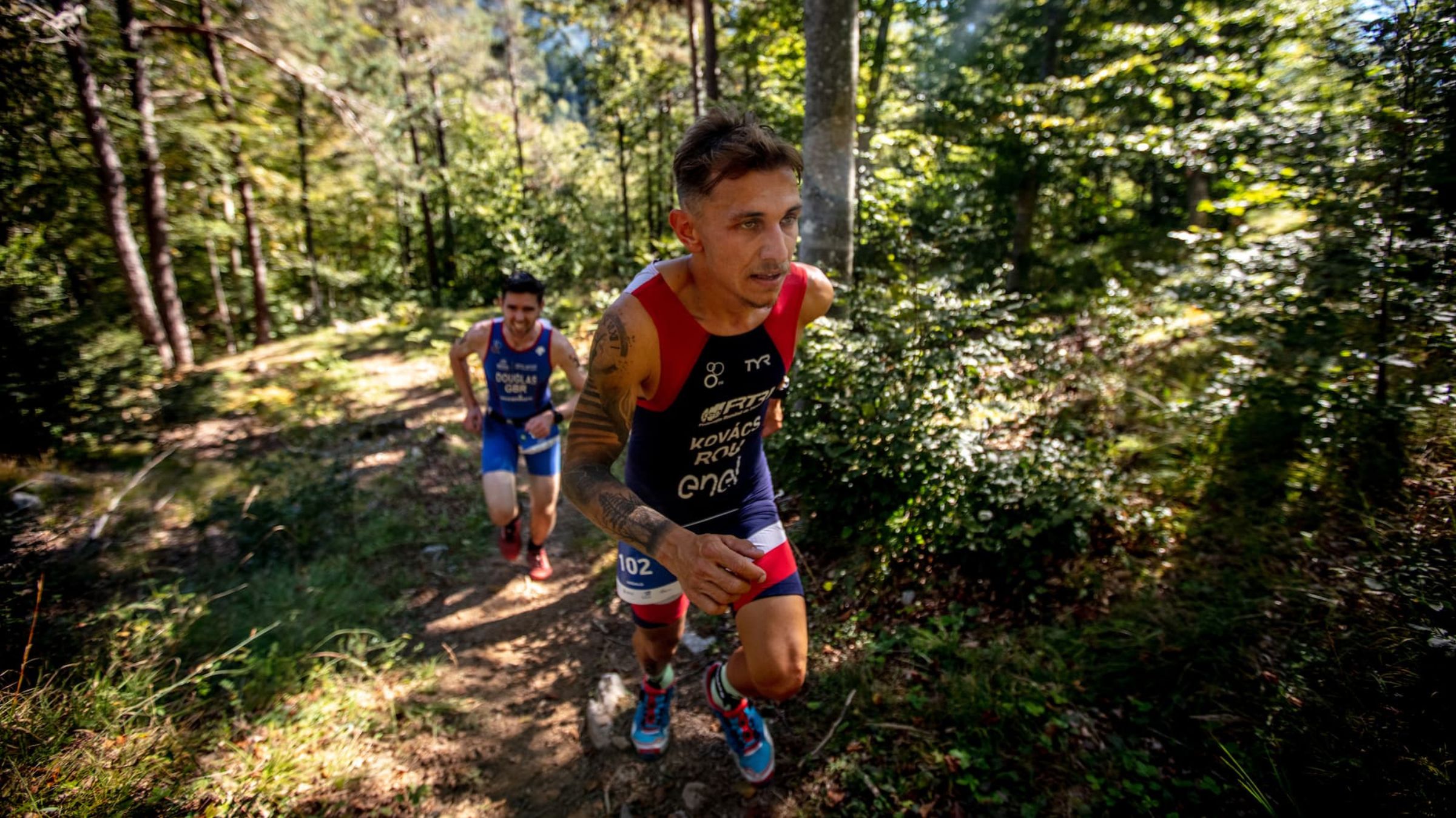 Two athletes race the Xterra World Championship 2022 in Trentino Italy.
