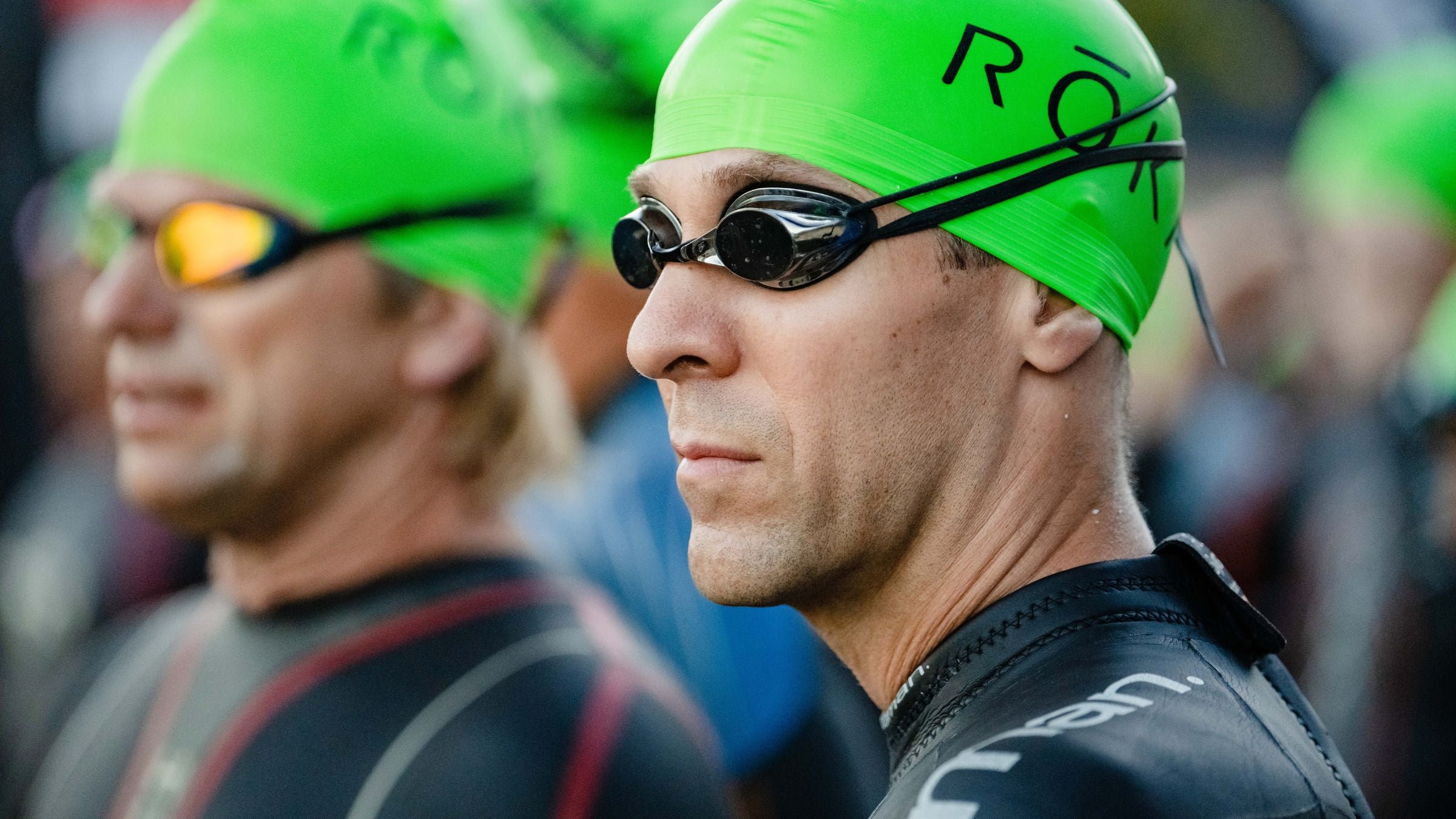 Is triathlon a midlife crisis sport? A man ponders the question as he lines up for a triathlon.